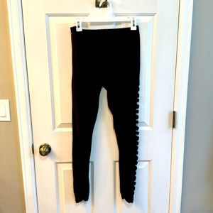 Women's Eye Candy brand black leggings with side detail. Size Medium.